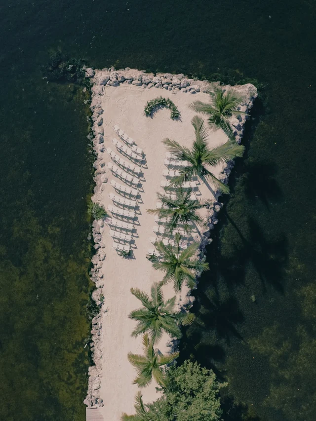 Emily + Zac | 9.13.25 ✨They say a little rain on your wedding day is good luck, and Emily & Zac certainly got the best kind. Just after they said “I do”, the skies opened up. But with an incredible vendor team and a little wedding-day magic, the celebration never skipped a beat.As the storm passed, the sky gifted us one of those unforgettable, quintessential, painted Florida Keys sunsets. Pure magic. From that moment on, the night was nothing short of joy-filled.Emily & Zac described their weekend as feeling like their wedding, birthdays, and Christmas all wrapped into one, and we couldn’t agree more. Merry *everything*, you two 🫶🏻Planner: Beth with @frondandfeatherevents
Florida Keys Wedding Photography: @michellegonzalezphoto
Rentals:  @keys_audio
Band: @baykingsband
Catering: @keylargoconchhouse
Bar: @anchor22mobilebar
HMU:@careliaisabel
Desserts:  @maggies_bakery_key_largo
Floral:  @luceloflor
Bathrooms:  @islandrestrooms
Venue:  @dolphinpointvillas#floridakeyswedding #keylargoweddings #floridaweddingplanner #keylargo #floridakeysweddingplanner